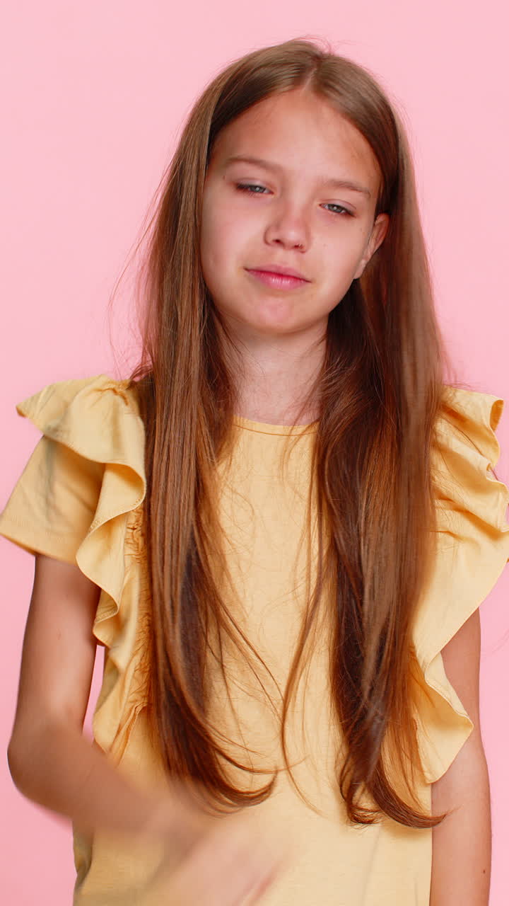 Child girl kid coughing into elbow with tired expression showing sickness concern health awareness