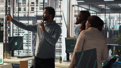 diverse team taking a selfie in modern office