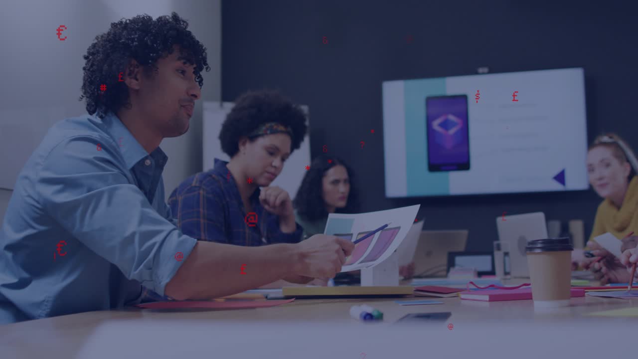 Man presenting color swatches, team reviewing smartphone mockup and discussing design choices