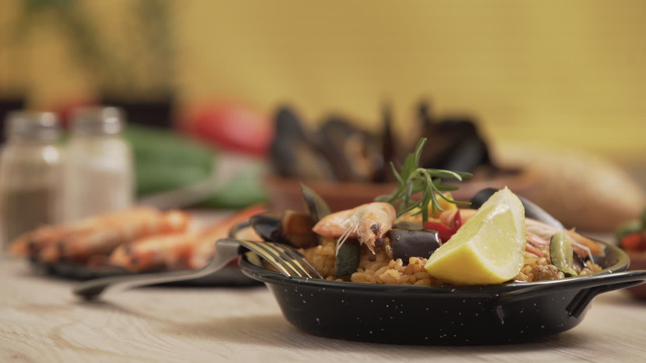 Paella traditional Spanish food, served on tapa plate