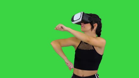 girl playing virtual reality dancing game experienced dancer on a green screen, chroma key