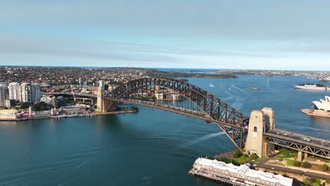 stunning aerial view of sydney harbour, panning from harbour bridge and opera house to reveal north sydney at sunset, australia
