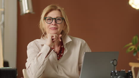 portrait of beautiful senior businesswoman smiling at camera