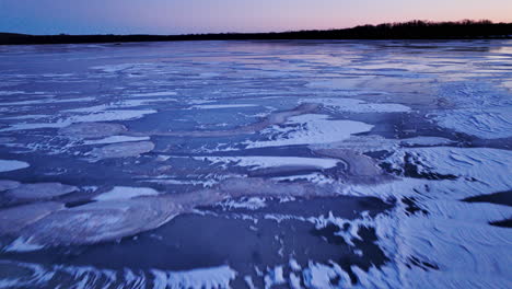 Video-from-a-drone-as-it-hovers-above-the-vast-expanse-of-ice-chunks-in-water