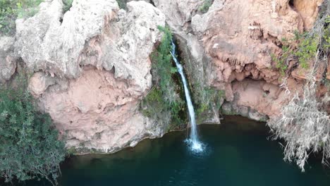 Small-waterfall-of-Pego-do-Inferno-in-Santo-Estêvão,-in-Tavira,-Algarve,-Portugal---Static-Aerial