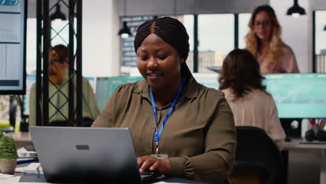 vertical video black corporate manager reviews planning documents and adjusts strategy
