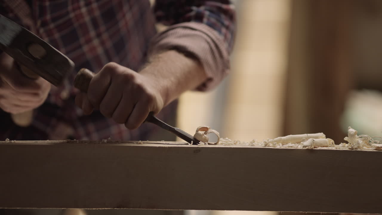 Woodworking with chisel and hammer