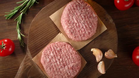 the raw burger on the cutting board slowly rotates.