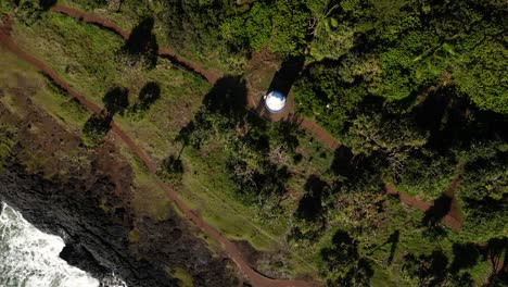 aerial view of a coastal lighthouse and path