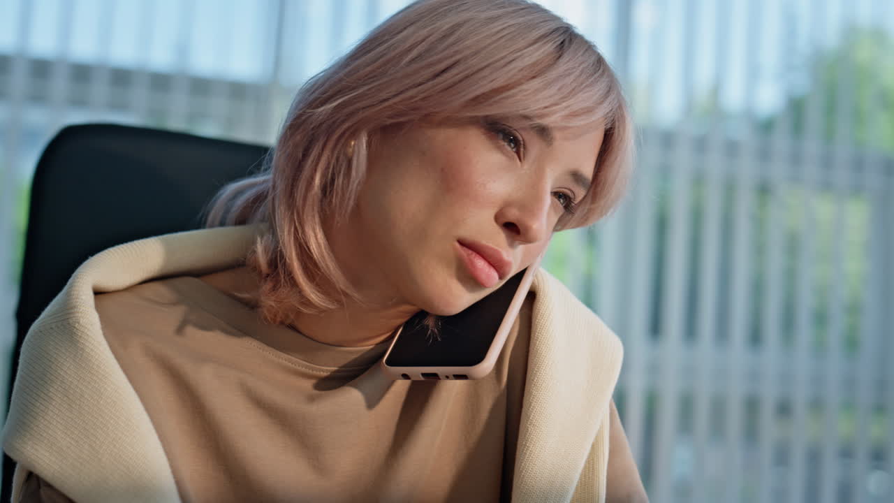 Lady employee working computer at office closeup. Businesswoman answering call