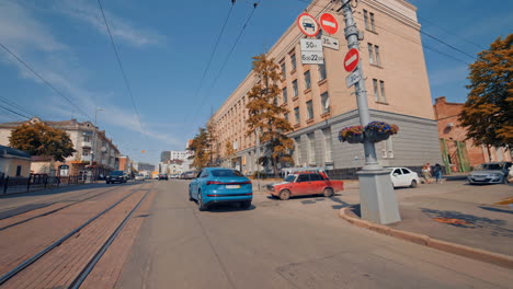 audi e-tron driving on road. full view of blue audi e-tron driving on road