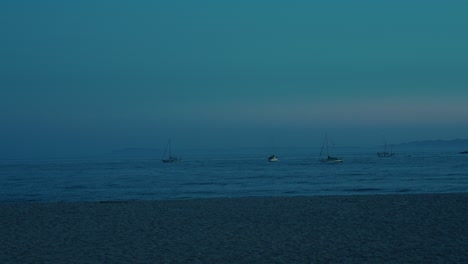 time-lapse of boats floating off santa barbara coast as day fades into twilight