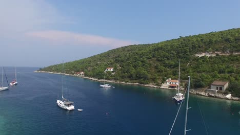 Sailboats-anchored-off-the-coast-of-Brac-Island,-Croatia