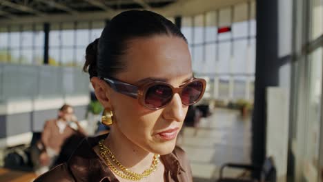 woman drinking coffee at the airport