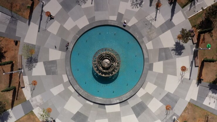 Aerial View of a Circular Park with Fountain