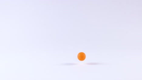 orange ball bouncing on a white surface