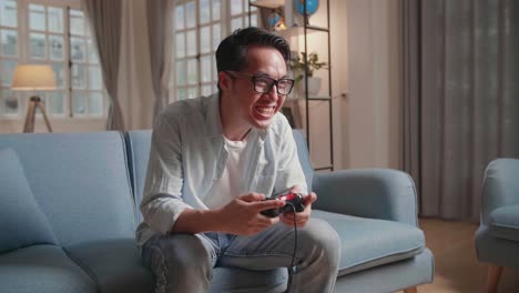 disappointed gamer playing video game during gaming competition using joystick
