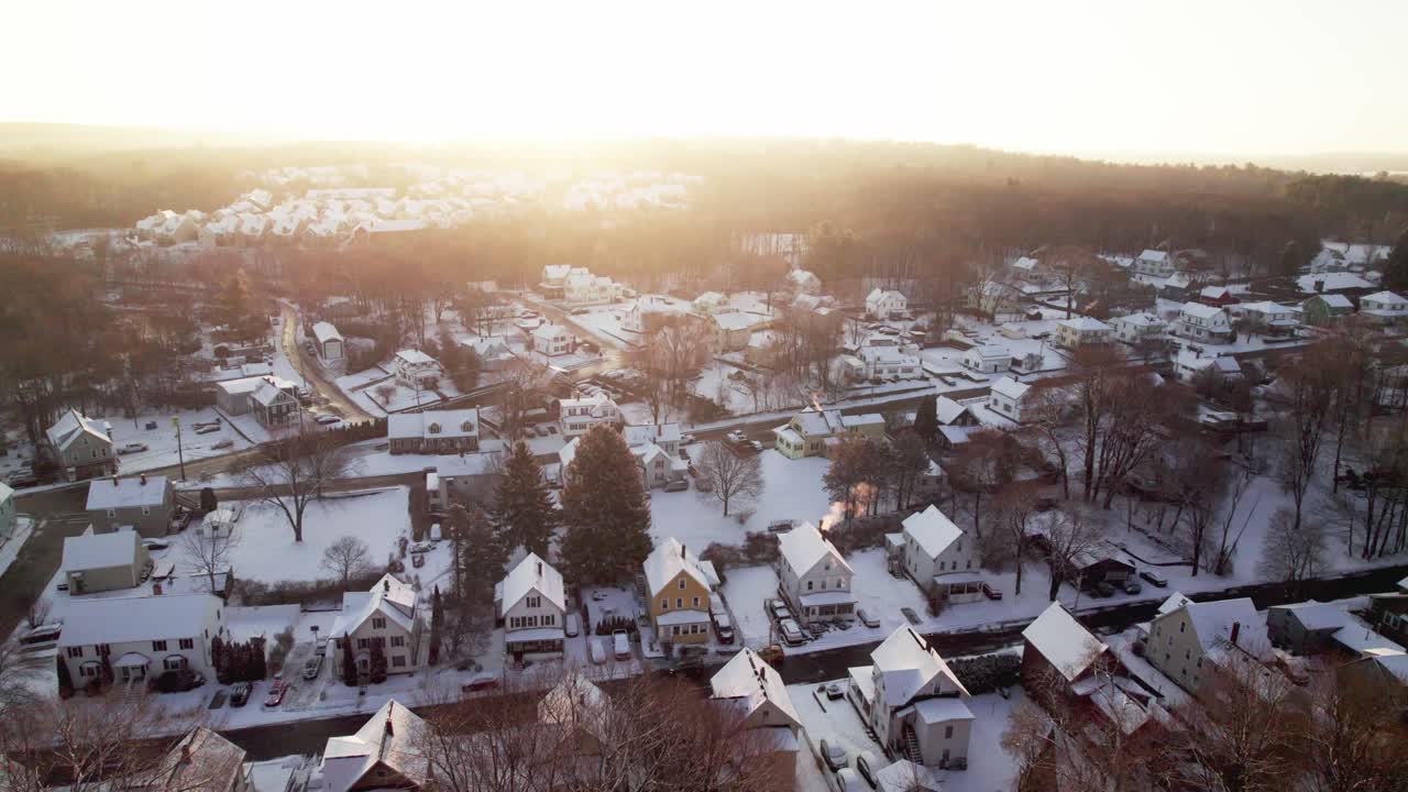 The glowing winter sunrise over a sleep residential area early in the morning