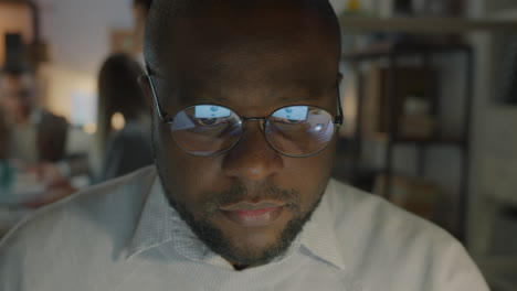 focused man working late at night in office