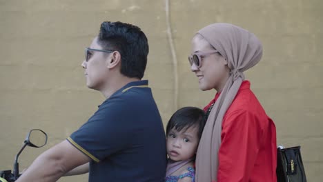 family riding a motorcycle