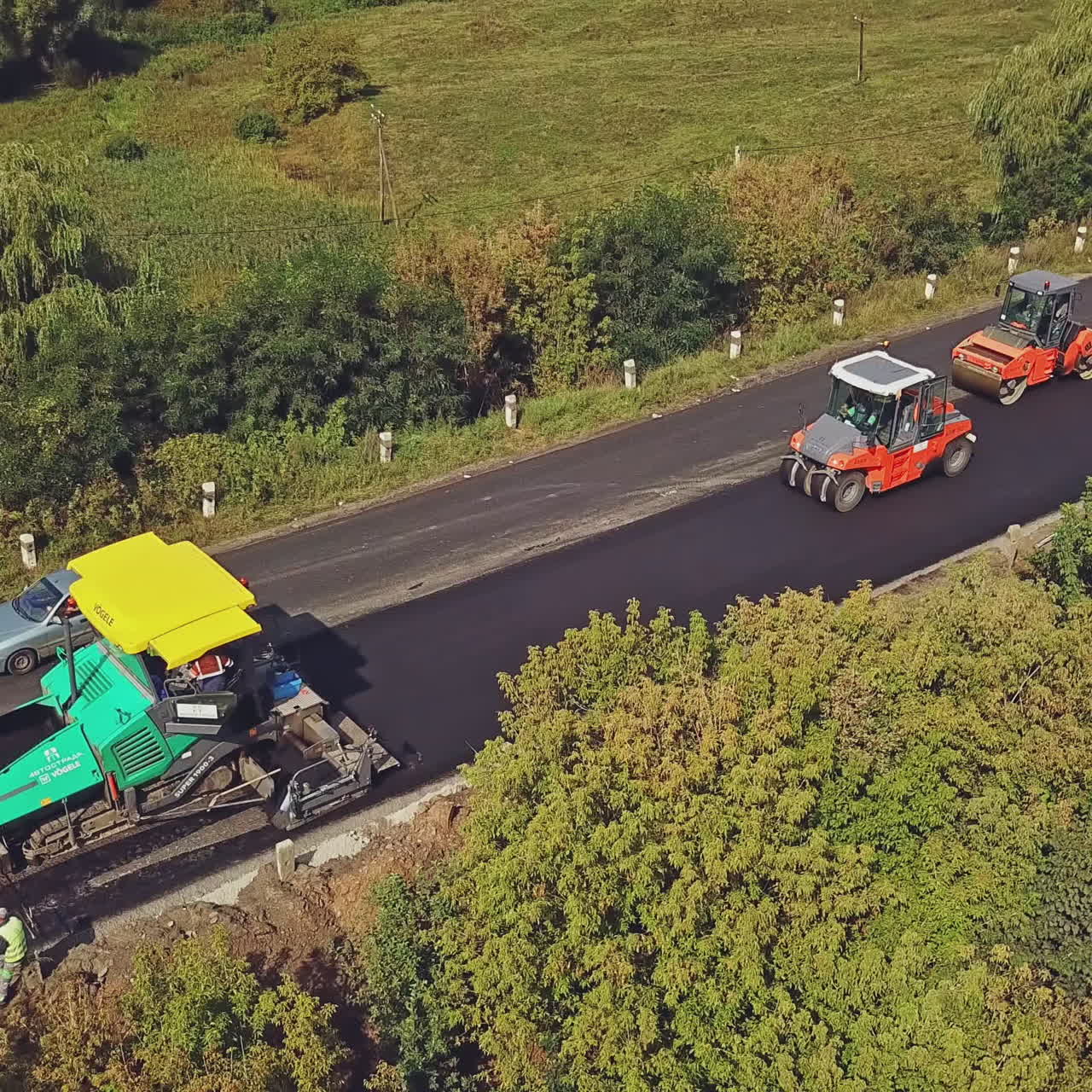 Aerial view. Laying a new asphalt on the road. Construction of the road