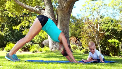 woman exercising with her baby