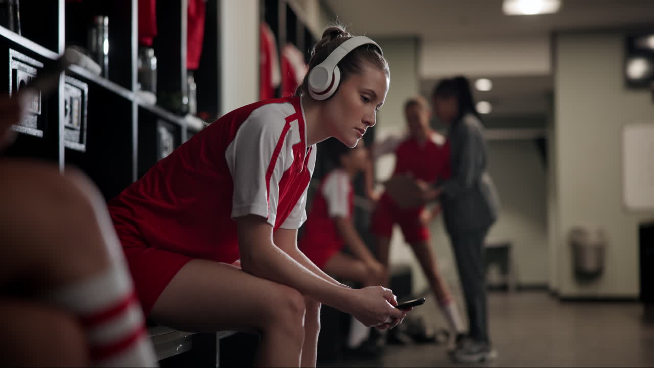 Woman listening to music in locker room