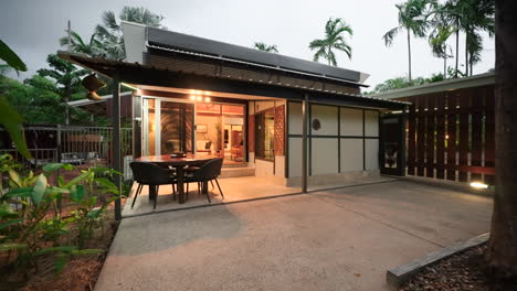 modern tropical house exterior at night
