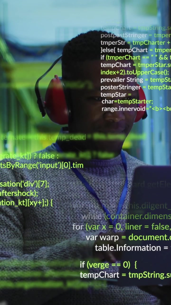 African American engineer works on data processing in server room.
