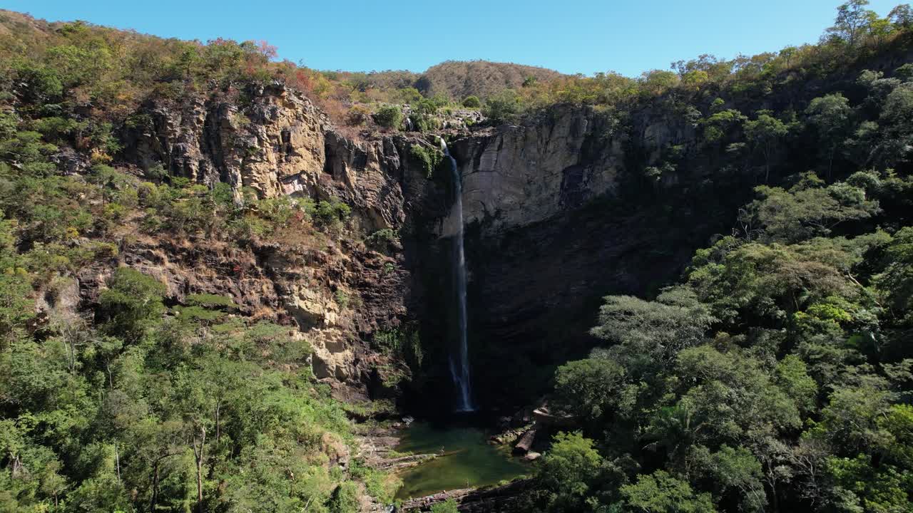 Stunning Aerial View of a Waterfall Cascading Down a Cliffside