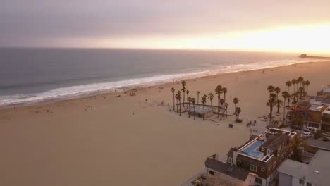 a flight over a southern california beach at sunset