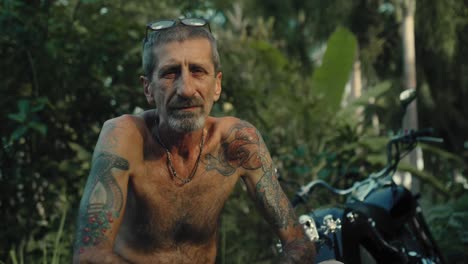 senior biker in a tropical jungle