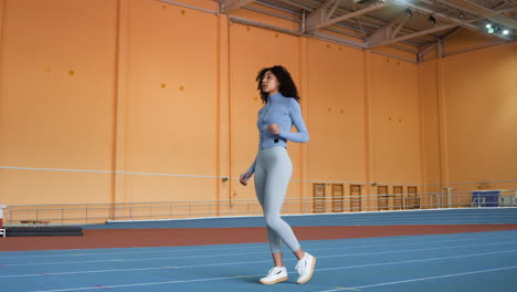 woman stretching indoors