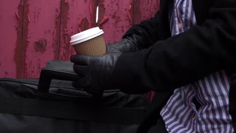 business woman with briefcase and takeout coffee medium shot