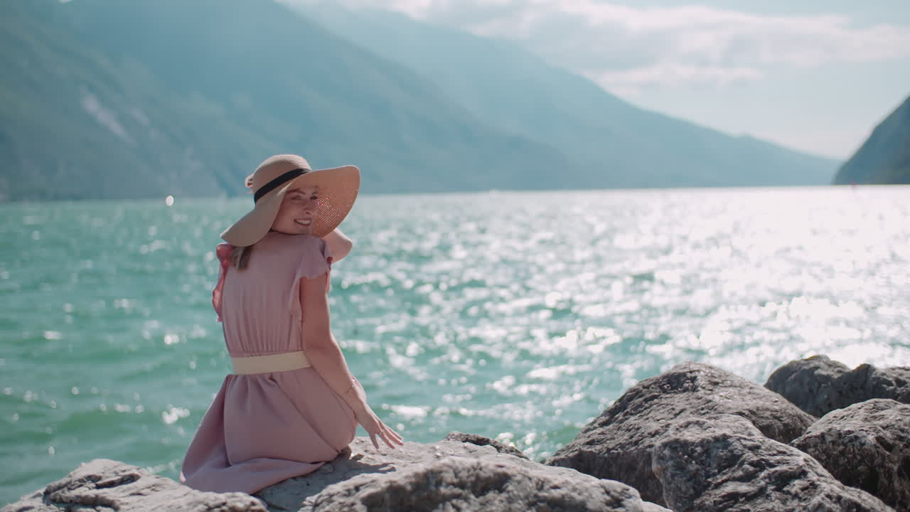 Happy Woman Sitting by Beautiful Seaside