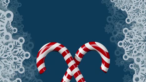 animation of christmas candies and snowflakes on navy background