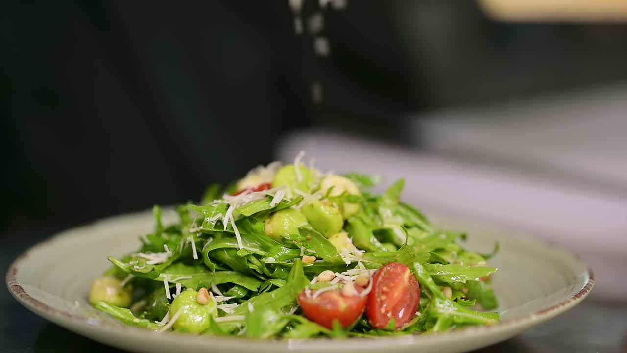 Chef In Kitchen Cooking Vegetables. Table with healthy food in the kitchen