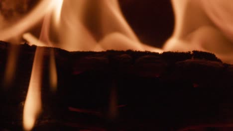 slow motion closeup of fire burning wood in a wood stove