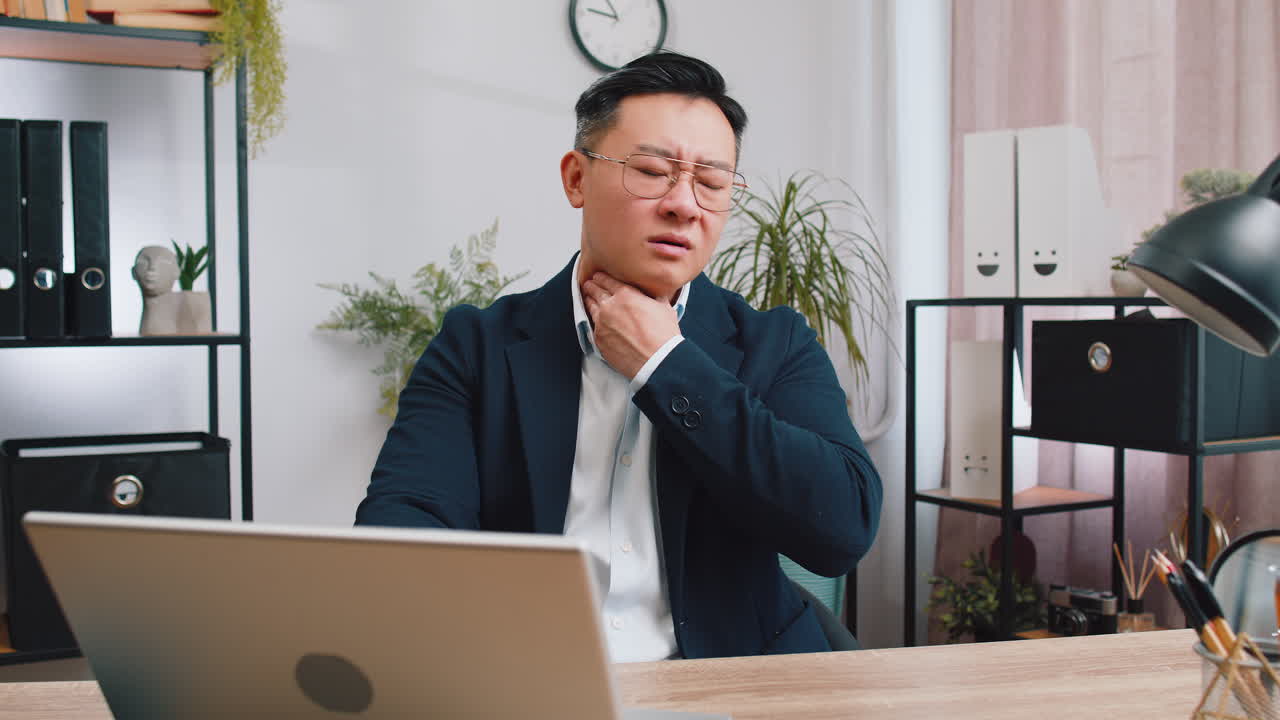 Asian office business man feeling unwell sick ill suffering from sore throat hurt swallowing pain