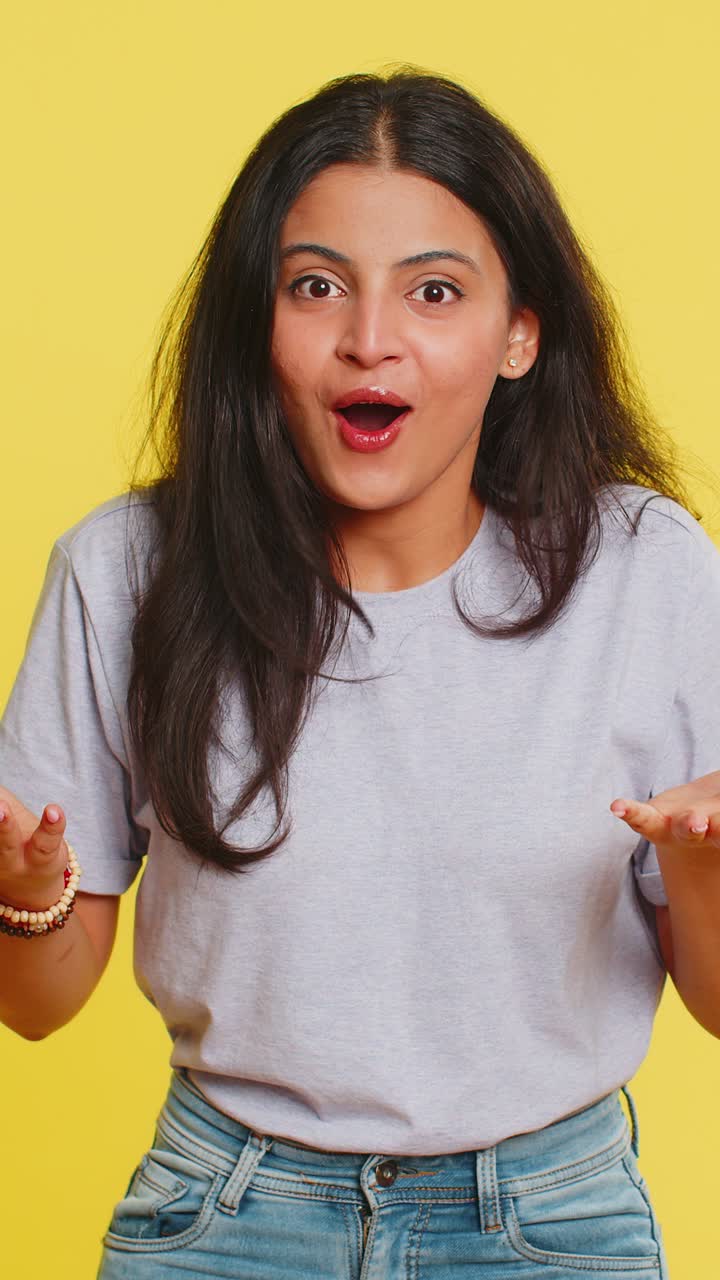 Excited amazed woman surprise looking at camera with big eyes shocked by sudden victory wow emotion