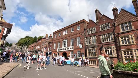 people walking near historic buildings