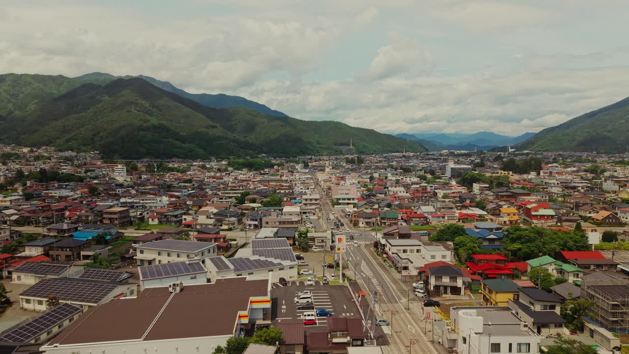 Aerial View of Town with Mountains in Background