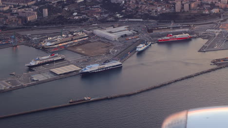 Seaside-Port-Terminal-For-Cruise-Ship-And-Cargo-Ship-Seen-From-Airplane-In-Marseille,-France-At-Night