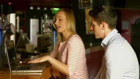 colleagues working at the bar together