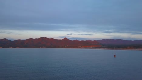 aerial view of sailboat in front of the coast of the national park of cabo pulmo in baja california.