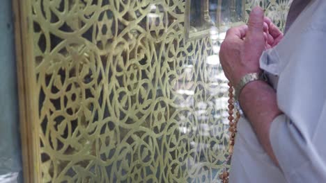 person praying at religious shrine