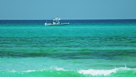 boat floating in crystal clear ocean water