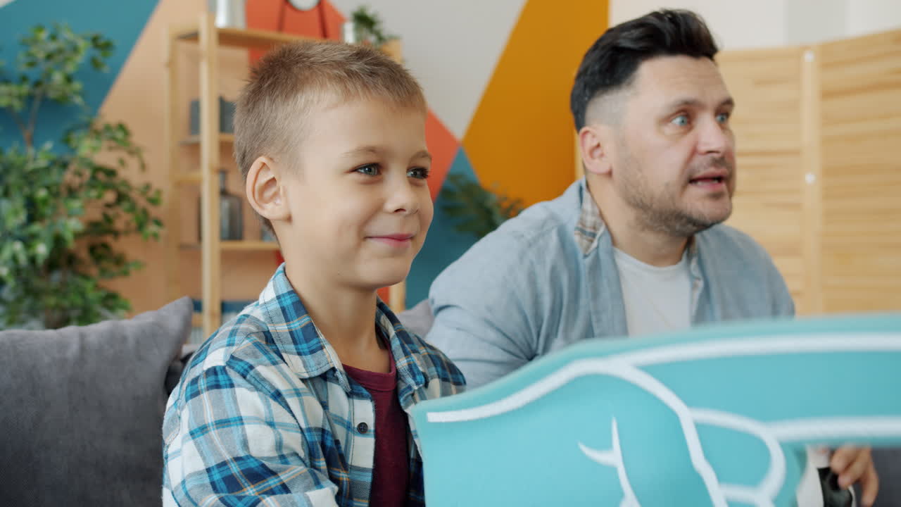 Father and Son Watching a Game Together