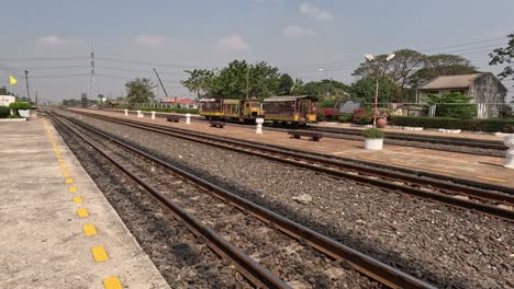 a train moves along the tracks at a station