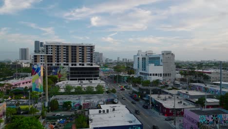 forwards fly above town development. various buildings along streets in artistic urban borough. miami, usa